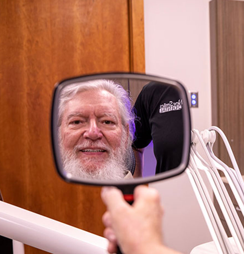 Patient smiling after their dental procedure