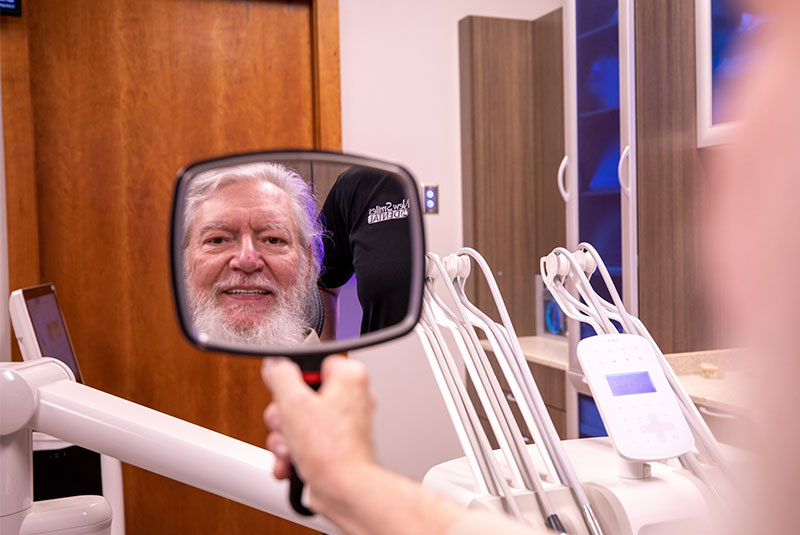 Patient smiling after their dental procedure
