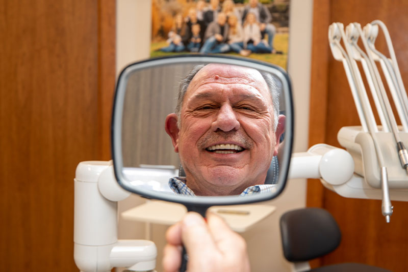 Patient smiling confidently after their dental procedure