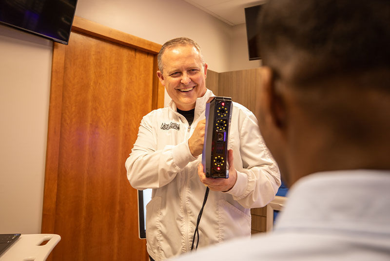 Doctor scanning patient for smile makeover procedure