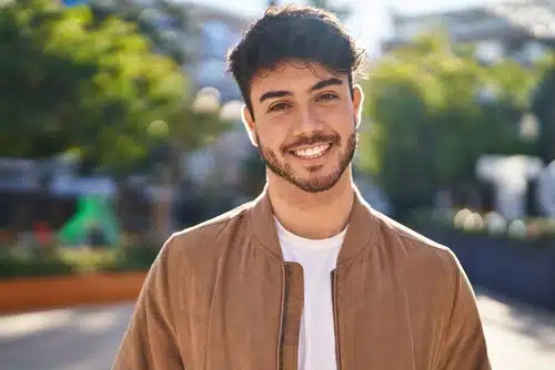 hispanic man smiling confident standing at park