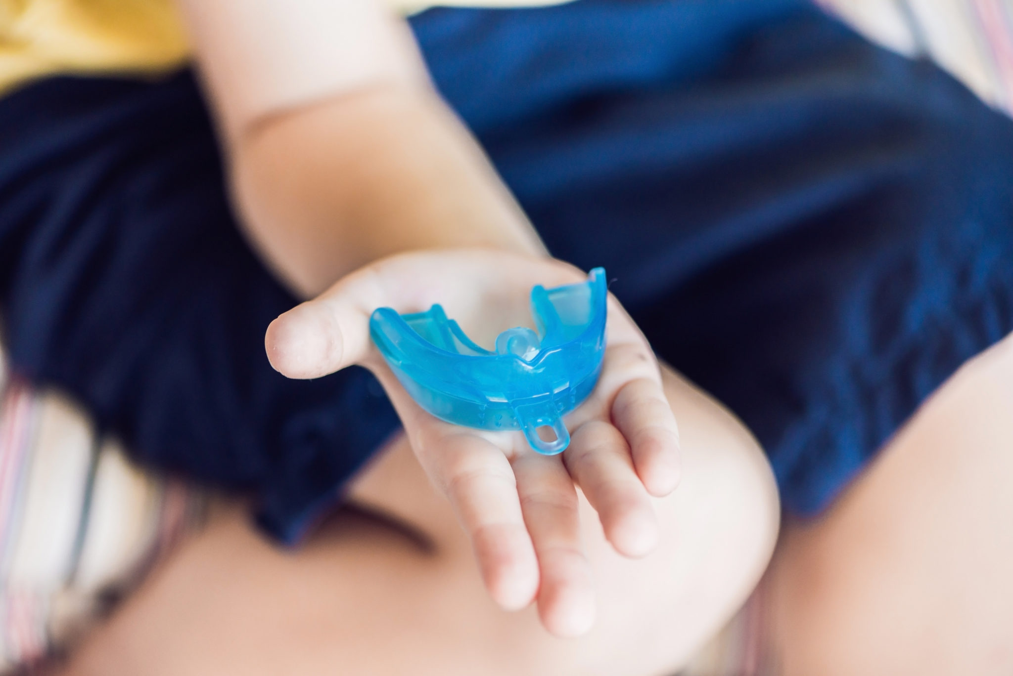 Dental Patient Holding a Nightguard