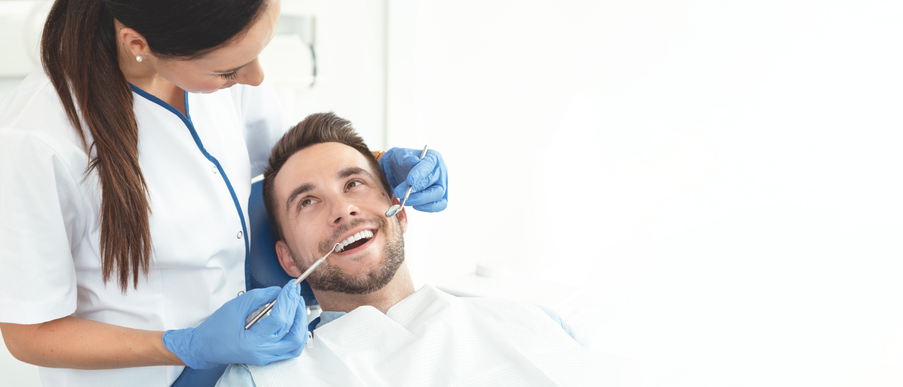Dental Patient Being Worked on and Smiling